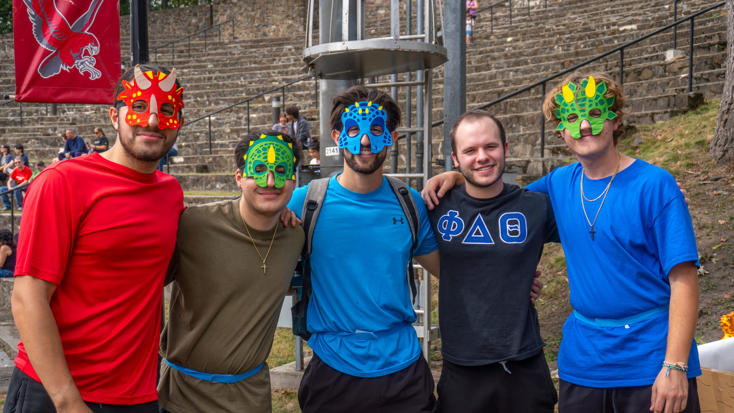 Fraternity guys pose in costume before their Greek Life showcase.