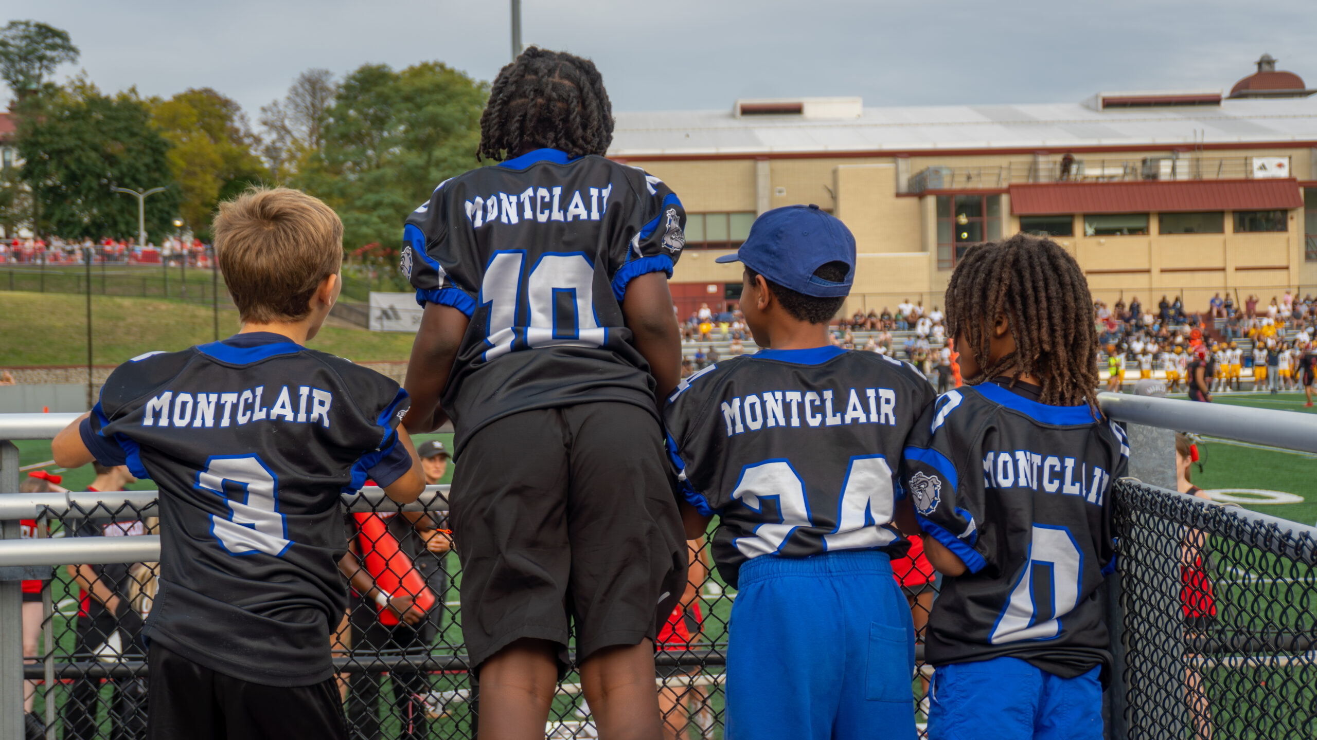 Future Red Hawks cheer on Montclair's Football team.