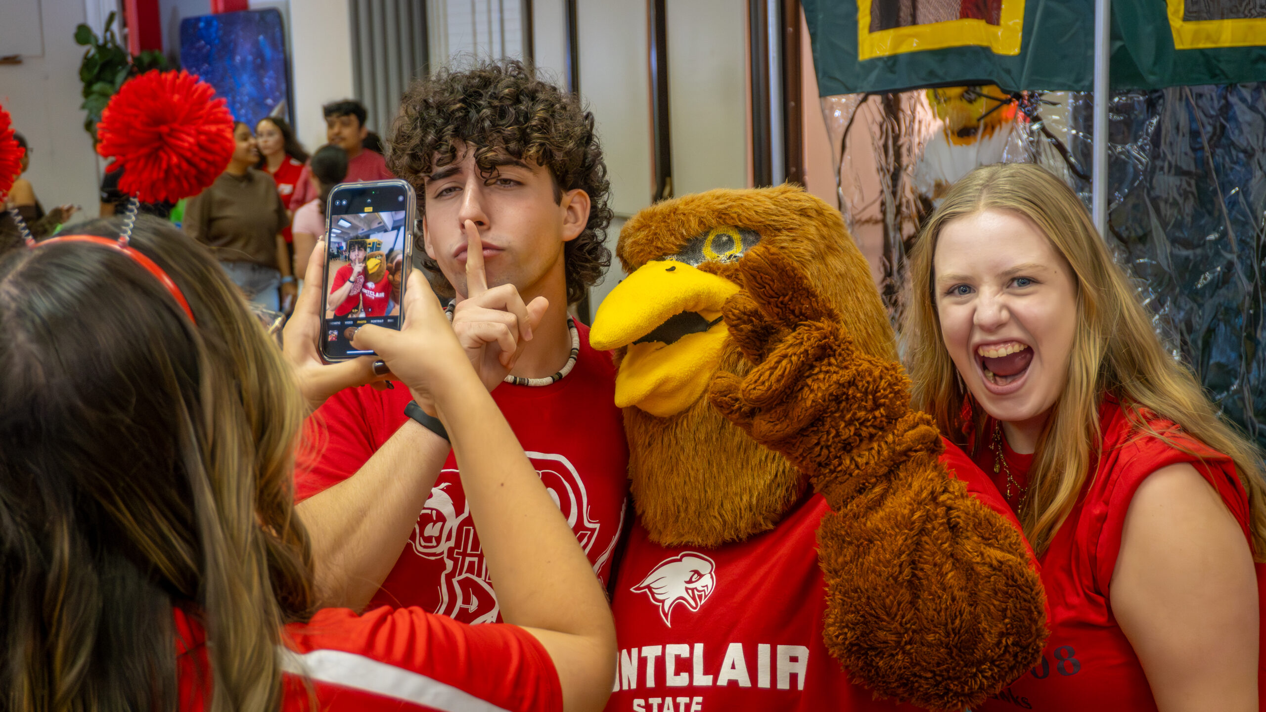 Students pose with Rocky's cousin, Ricky.