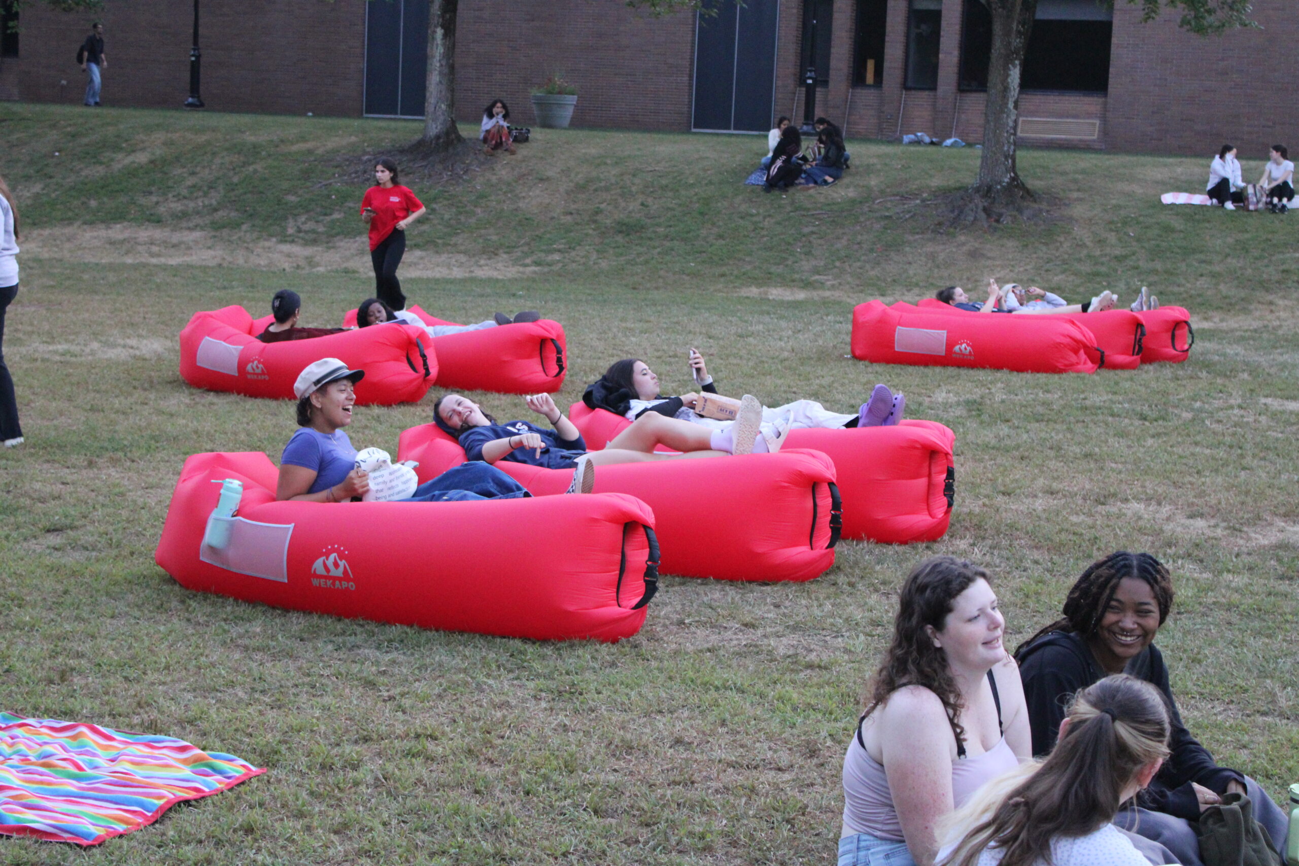 Students laughing with their friends before the movie starts. Jack Takouezim | The Montclarion