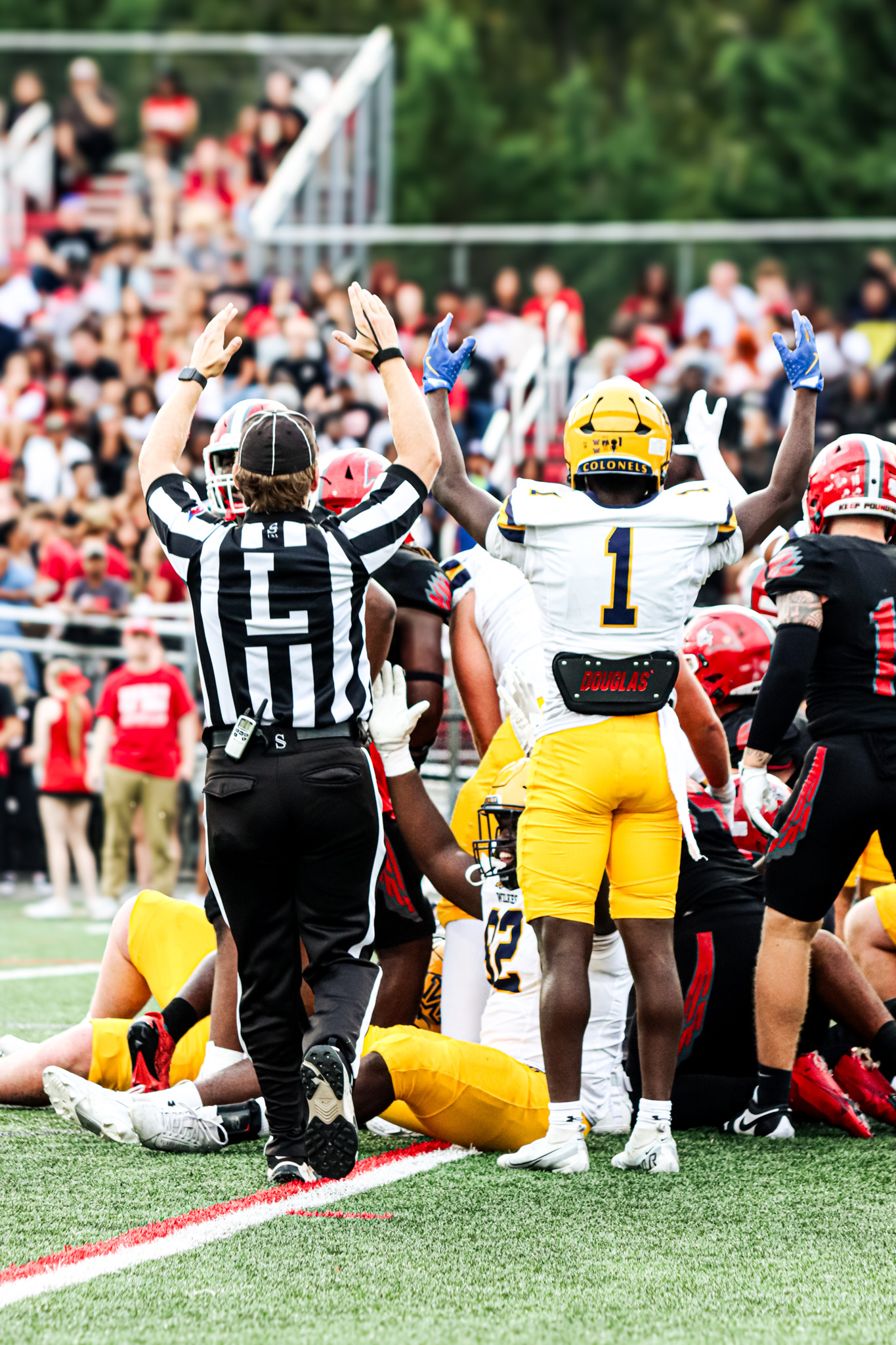 Officials signal a touchdown for Wilkes during the Colonels' road victory over Montclair State.