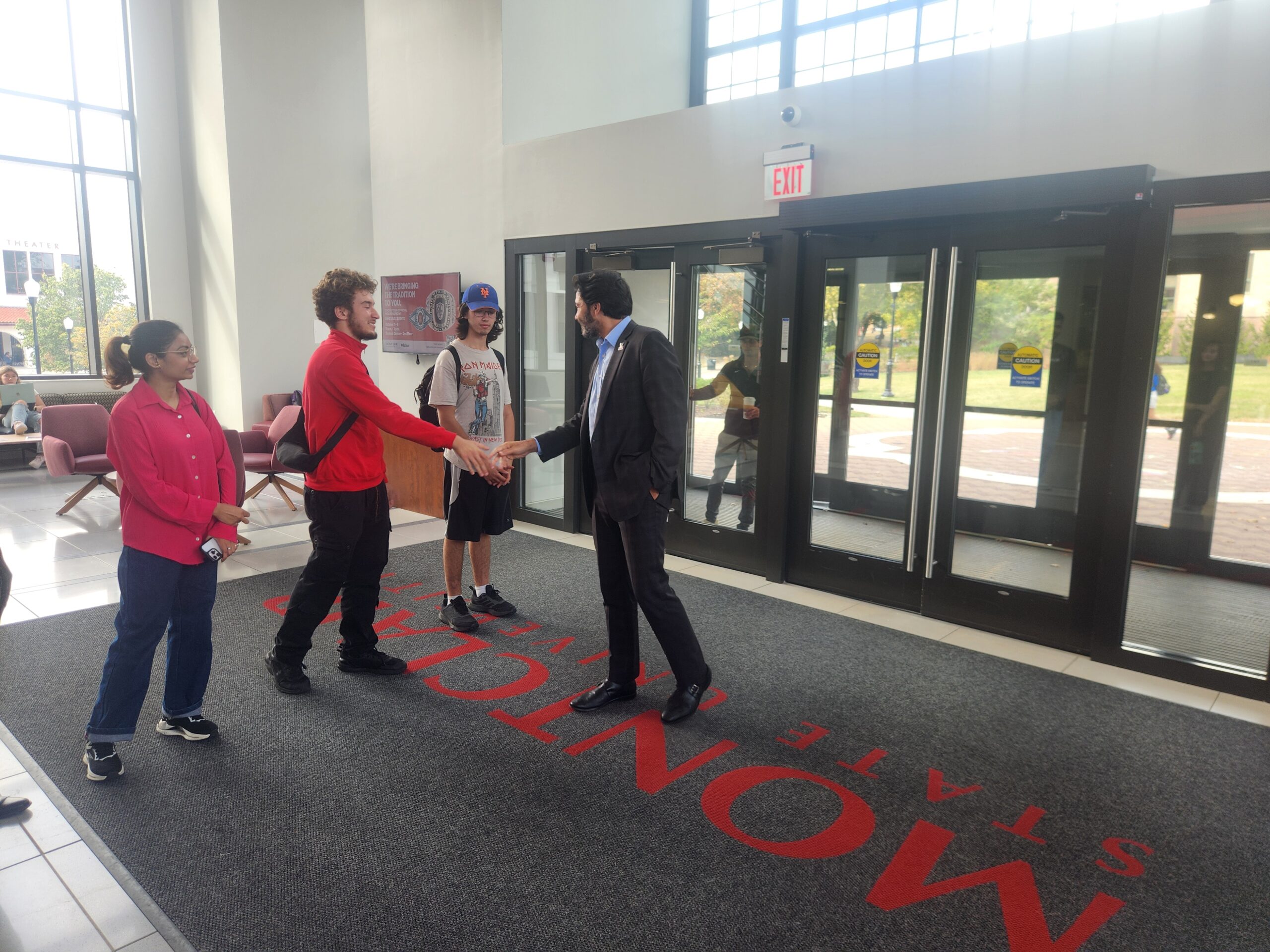 Dr. Jonathan Koppell, university president, greets guests for his Oct. 7 Walk With The President special event in Cole Hall lobby