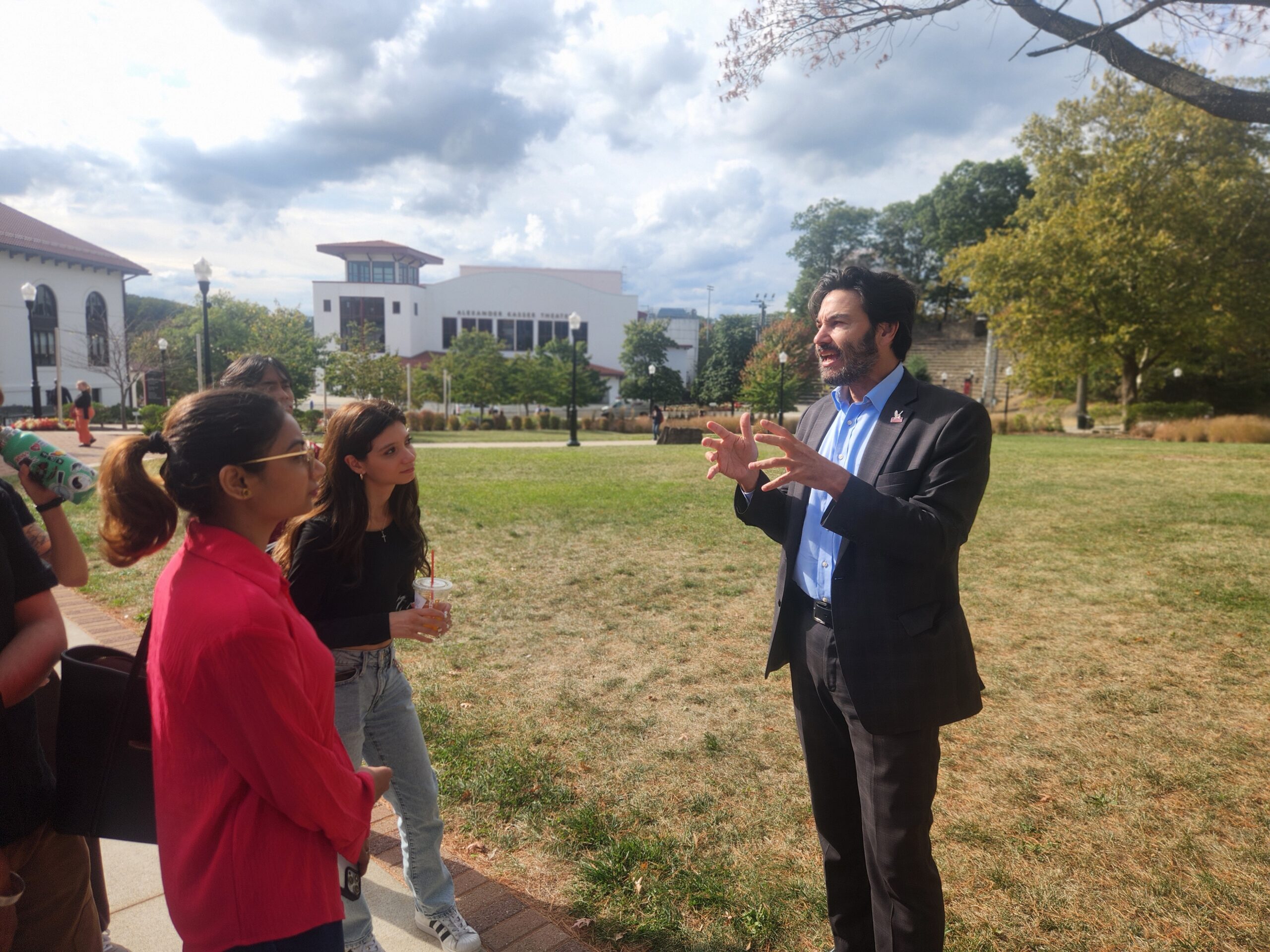 Dr. Jonathan Koppell, university president, responds to questions about campus parking outside Cole Hall during the Oct. 7 Walk With The President special event.