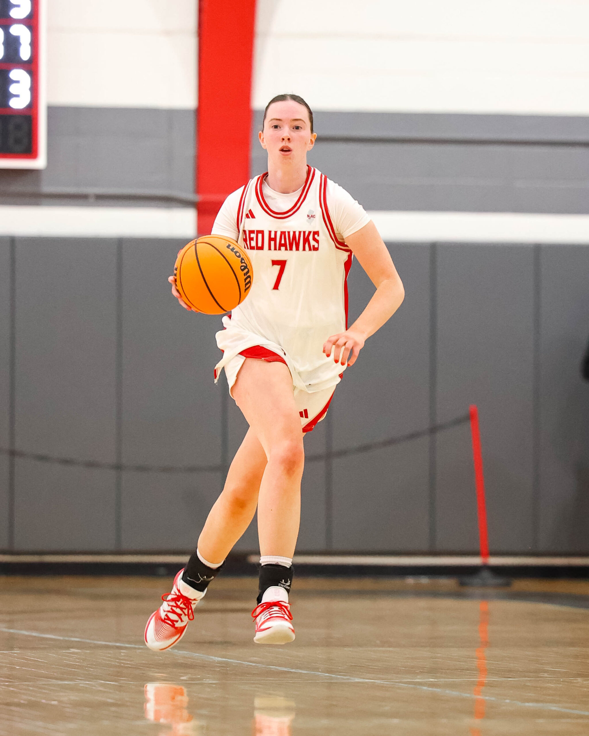 “My sister likes talking to me at basketball games,” said Mara McHugh. “I’ll look over at her while on the court, and I’ll see her trying to sign to me.” Photo courtesy of Montclair State Athletics