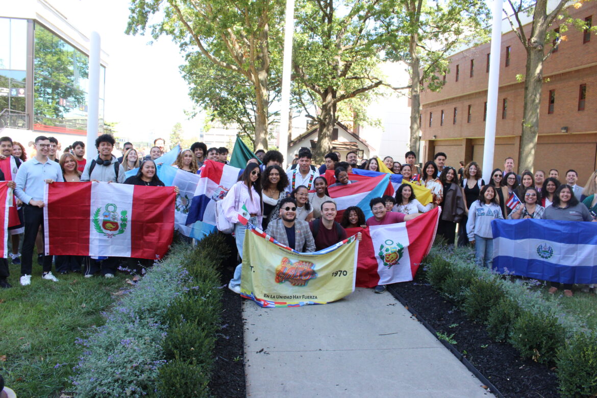 Attendees for the Hispanic Heritage Month flag raising event, celebrating their flags and Montclair State's diverse campus culture. Montclair State is an hispanic serving institution. Kaitlin Swift | The Montclarion