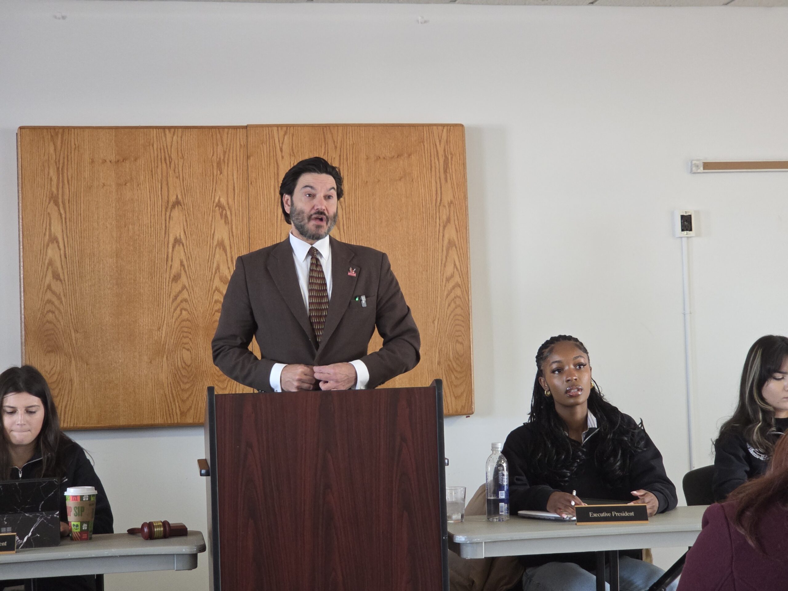 Jonathan Koppell. university president, talks about the College of Humanities and Social Sciences (CHSS) restructuring at the Dec 3 CHSS town hall in Student Center room 411.