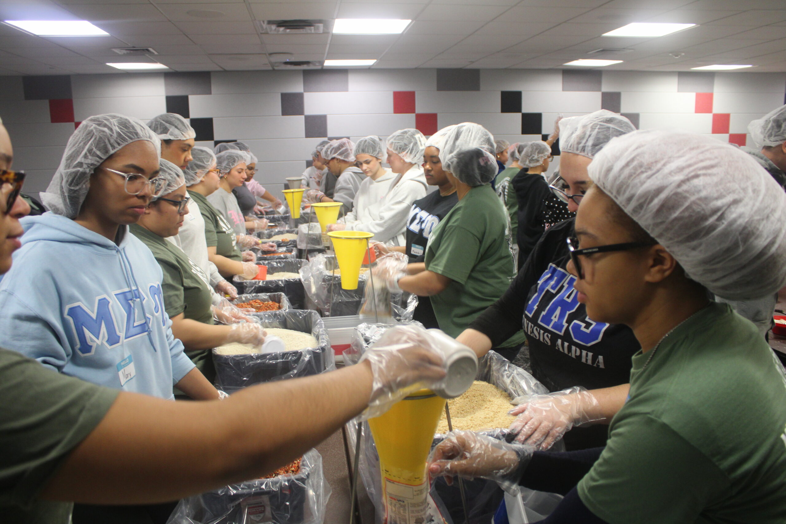 Students packaging food in the Student Center. Jack Takouezim | The Montclarion