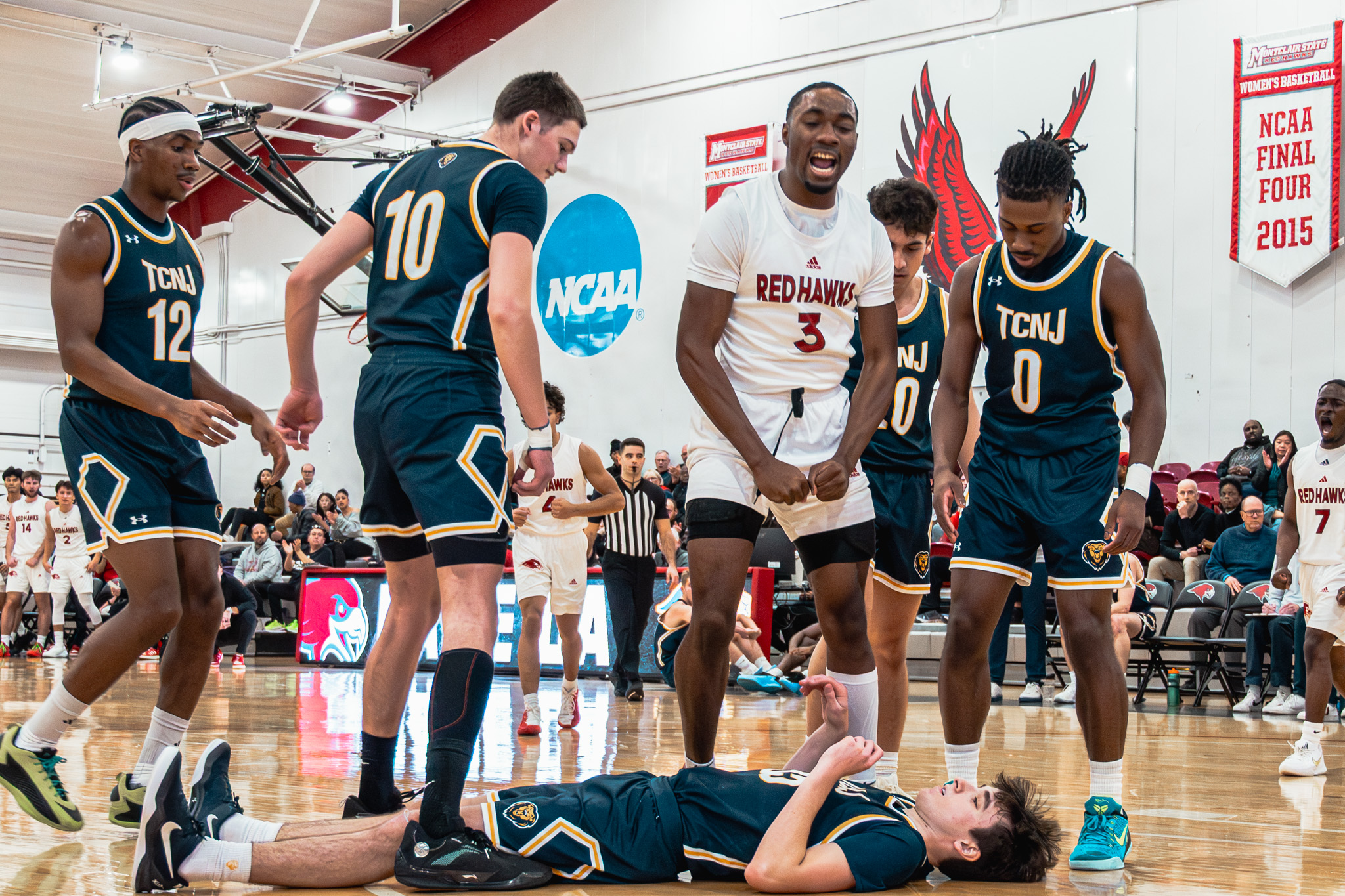Montclair State junior Ahmad Robertson flexes after an and-one opportunity. The Red Hawks defeated TCNJ, 76-72. Owen Klasey | The Montclarion
