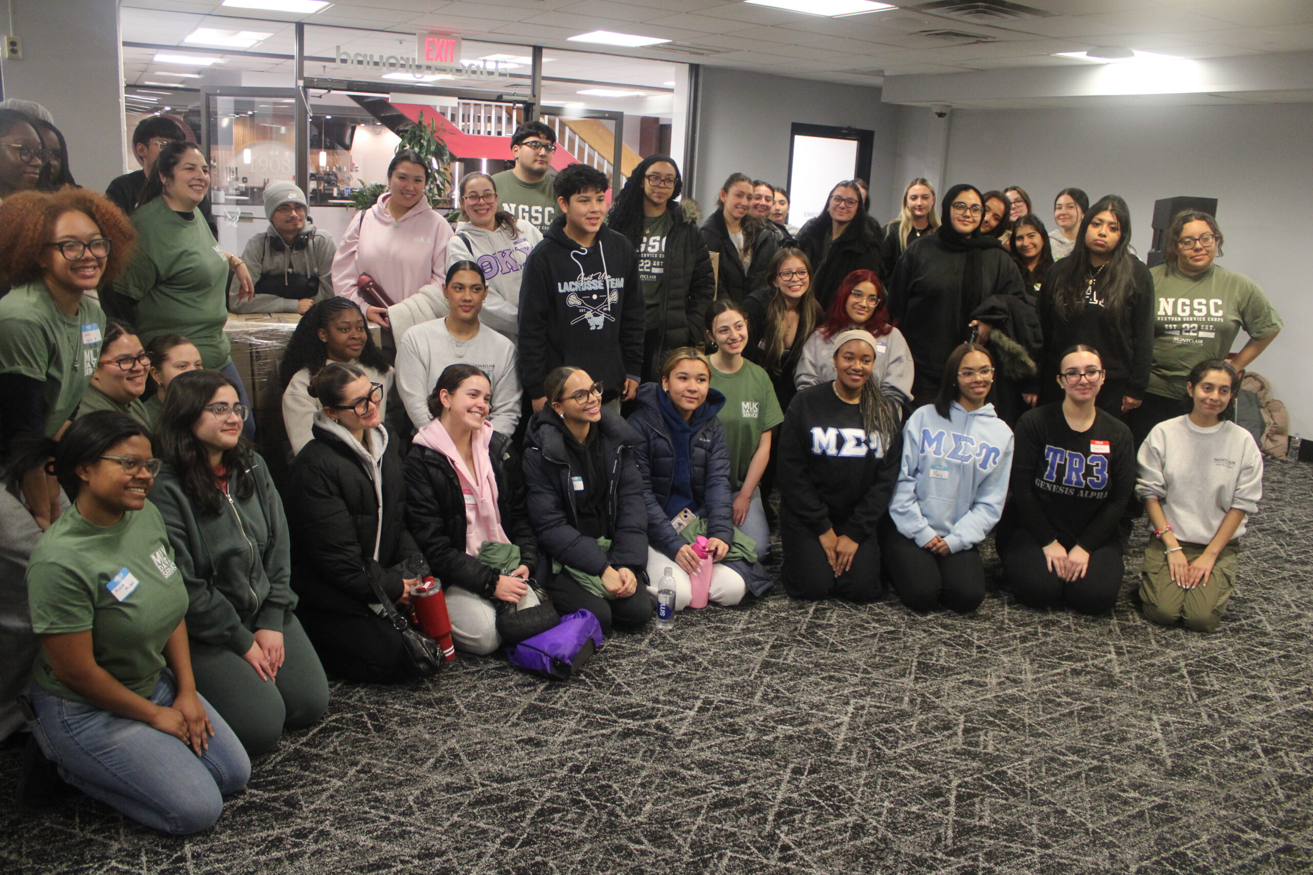 Students posing for a group picture after all the hard work they did at the Student Center. Jack Takouezim | The Montclarion