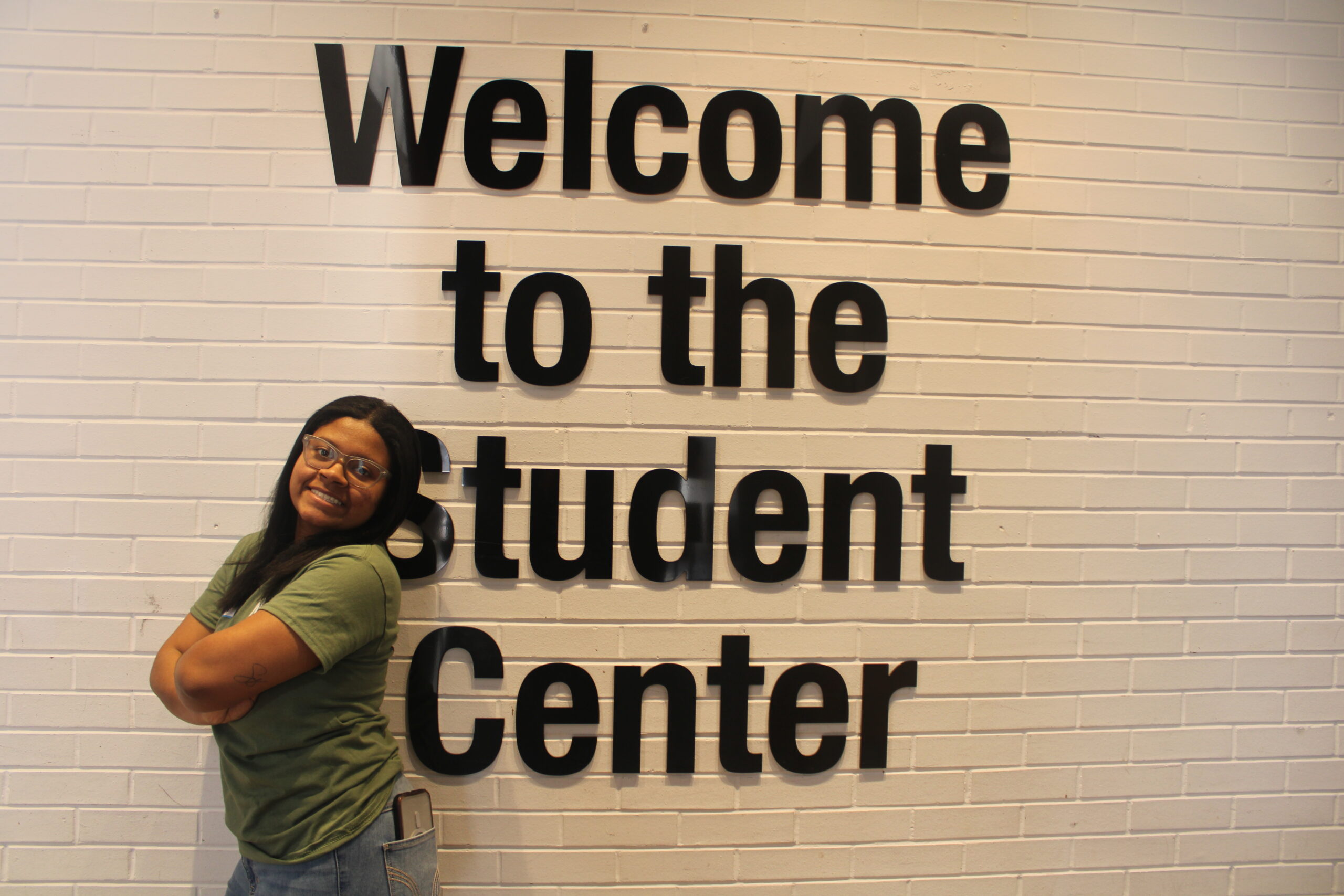 Azzure McLeod confidently posing for a picture in the Student Center. Jack Takouezim | The Montclarion