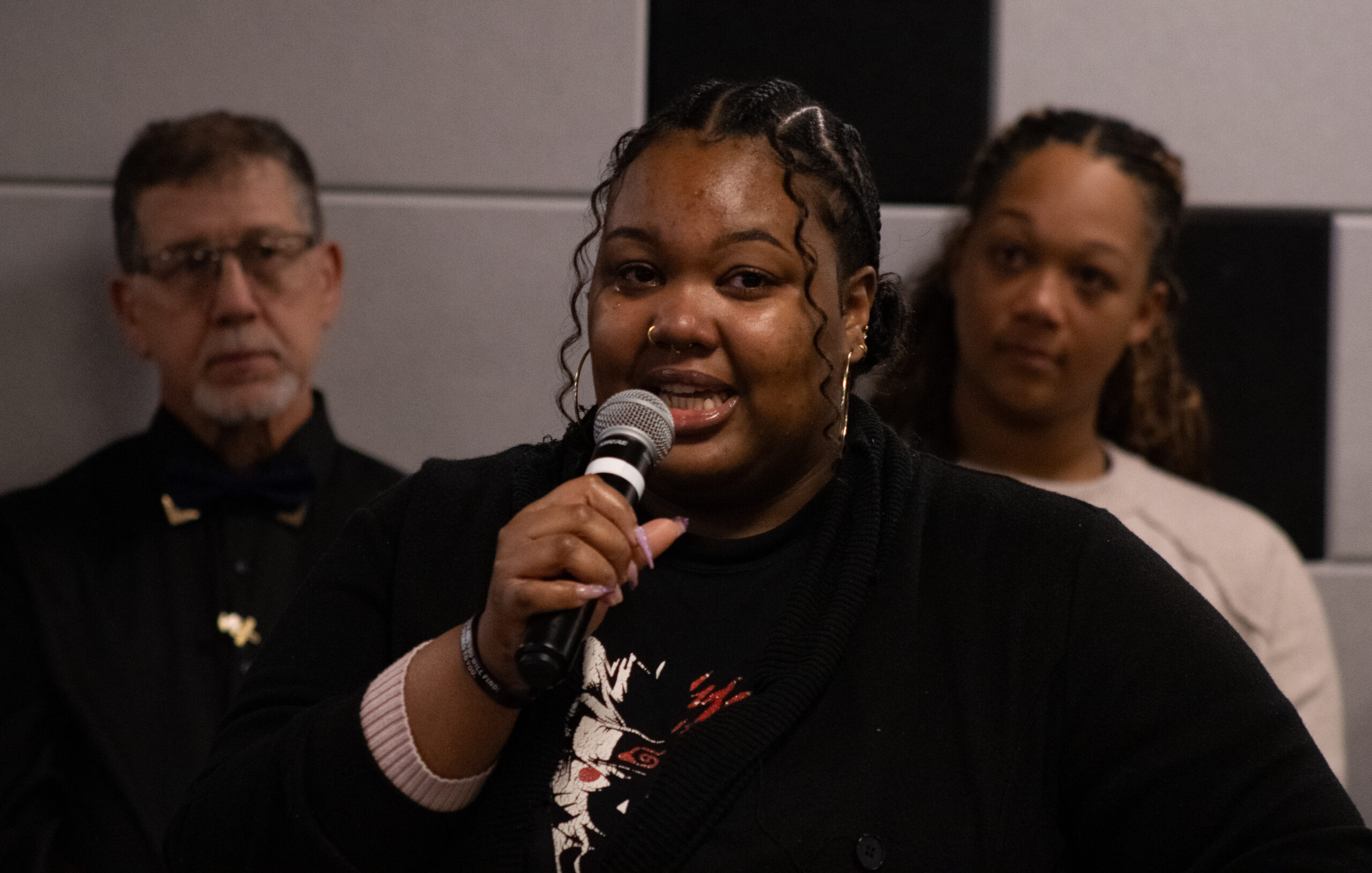 Nyaisha Green, a senior mathematics major, testifies to how Menegus touched her life during a Feb. 4 remembrance ceremony in the first floor Student Center underground.