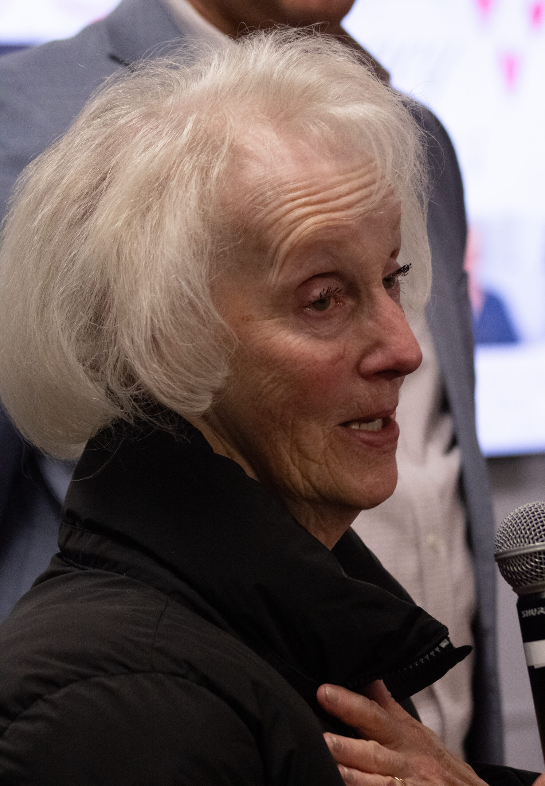 Kathy Bove of Clifton, sister of Nancy Menegus, speaks at a Feb. 4 memorial service in remembrance of Menegus, a beloved C-store food services supervisor, in the first floor Student Center underground.