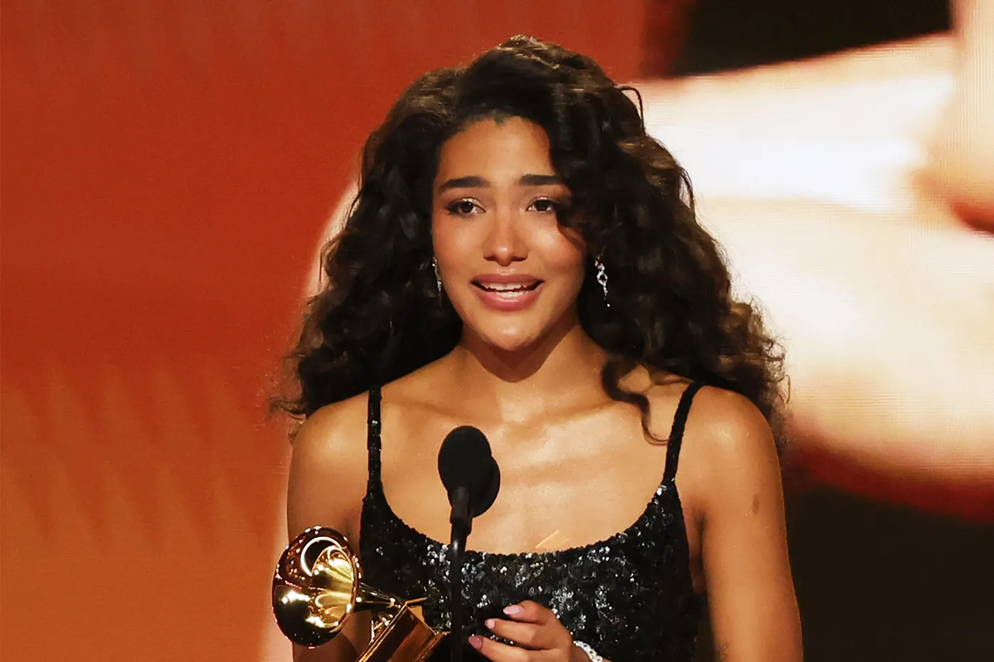 In her acceptance speech for Best New Artist at the Grammys, Olivia Dean highlighted the importance of immigrants in America. | Getty Images for The Recording Academy