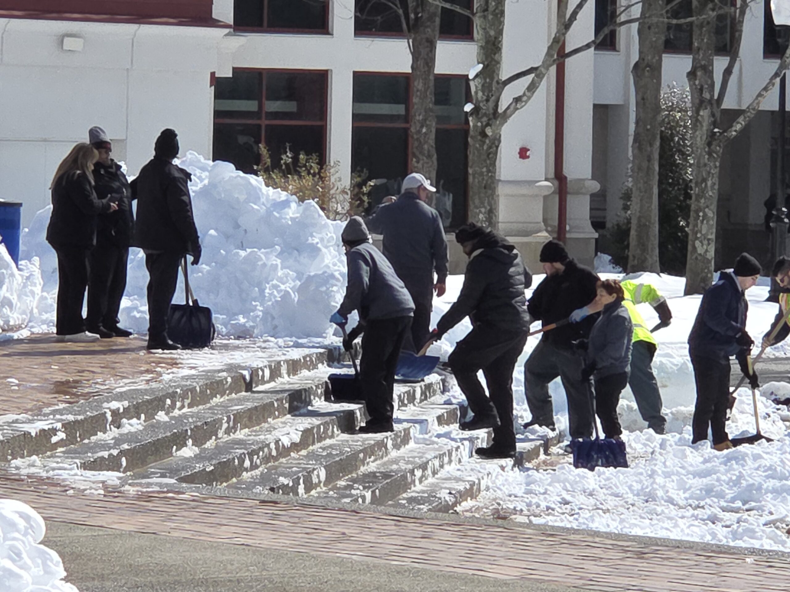 Workers clear snow from the outer Student Center steps after the blizzard on Feb. 25.