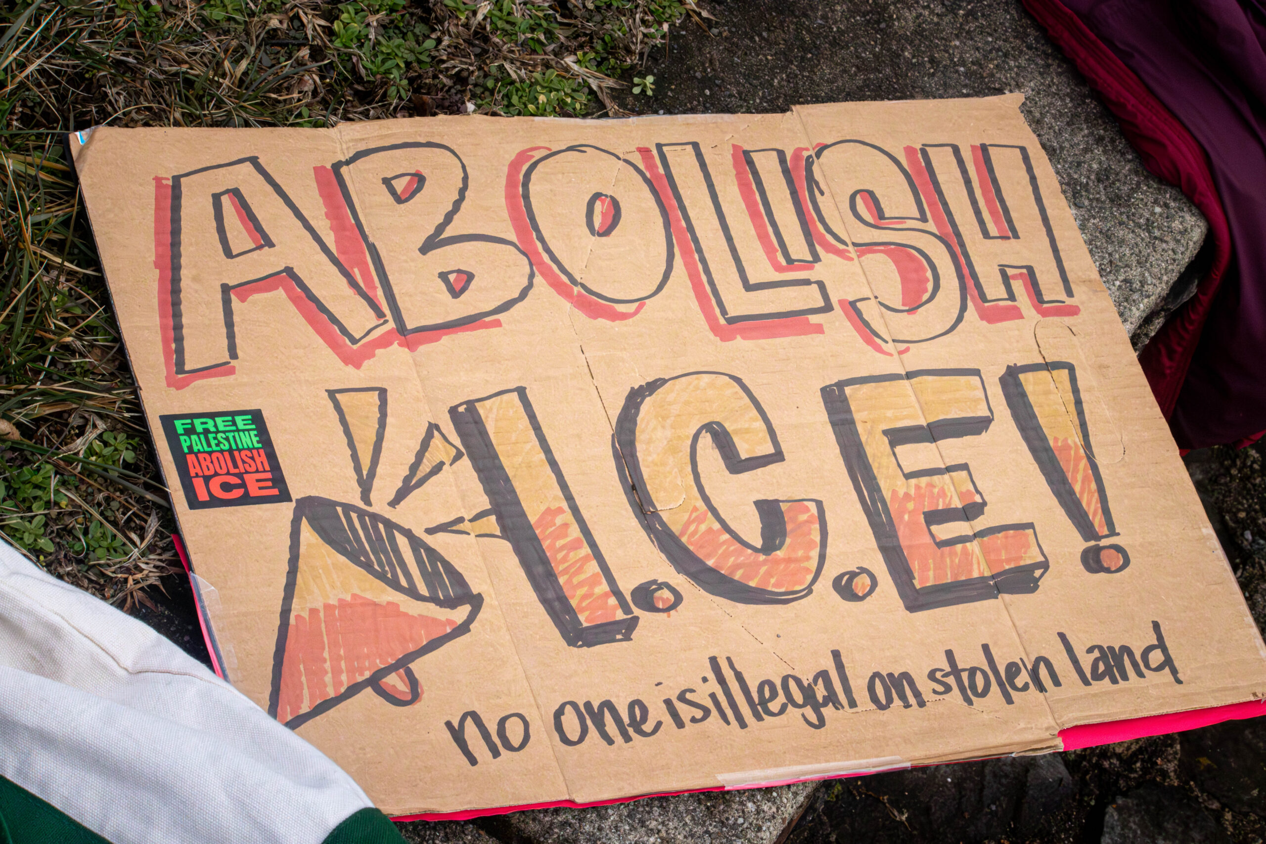 "Abolish ICE" sign held by students during the protest.