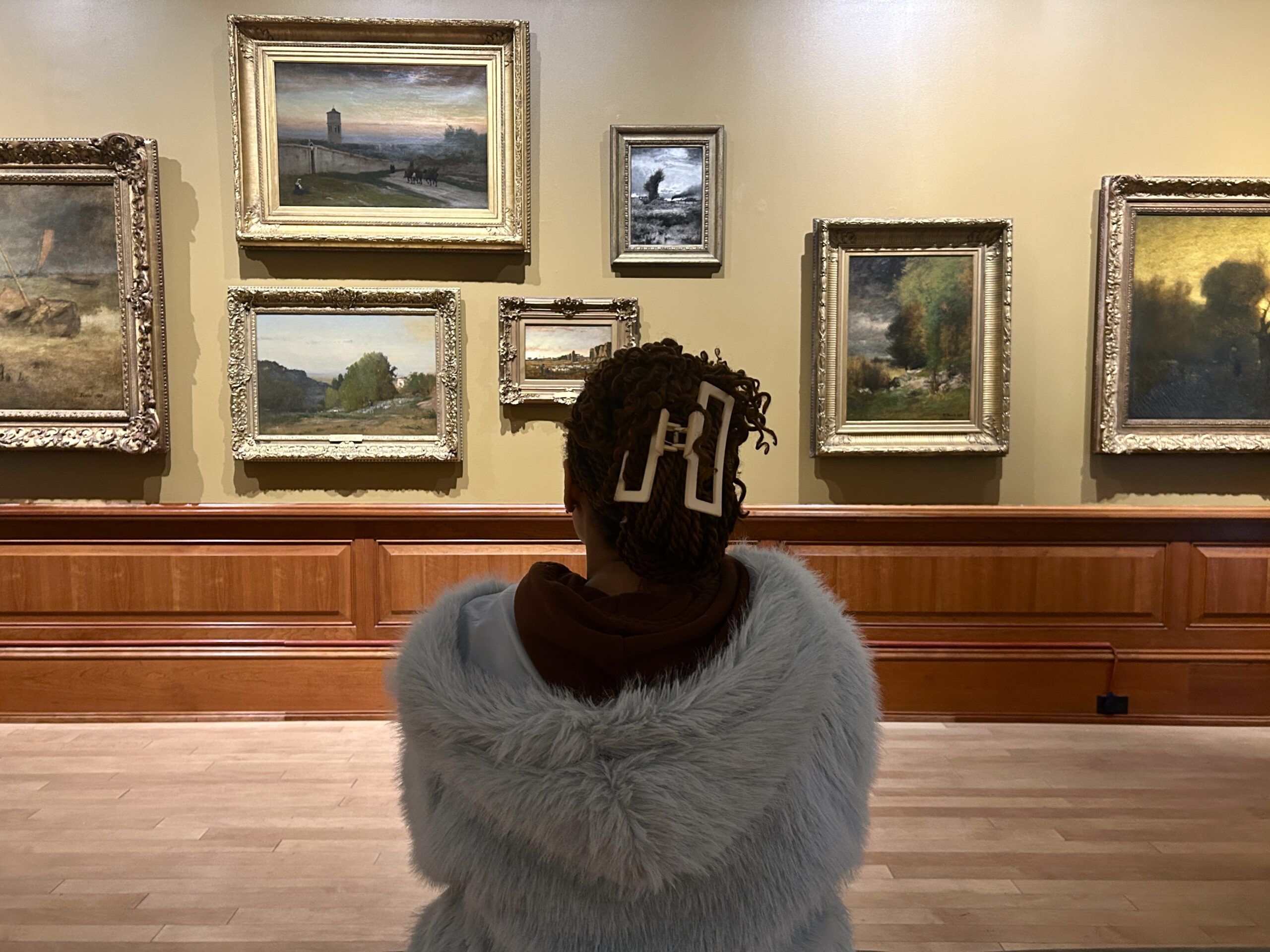 Student Ava Pickering viewing the Visionary Landscapes exhibit at Montclair Art Museum