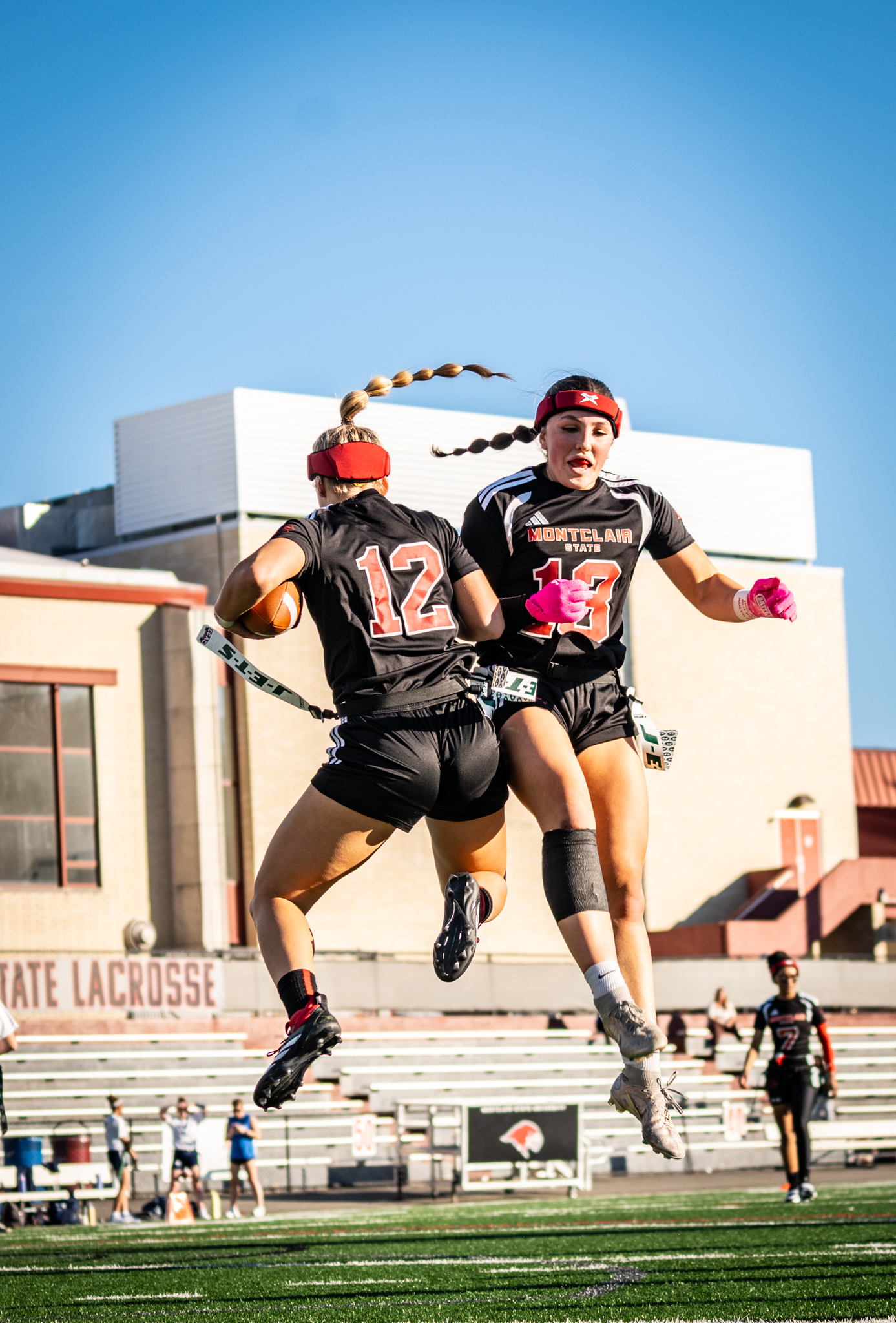 Genevieve Fara and Maya Anico met playing club rugby at Montclair State. Now, they are once again teammates, as part of a pioneering flag football season for the Red Hawks. Photo courtesy of Montclair State Athletics