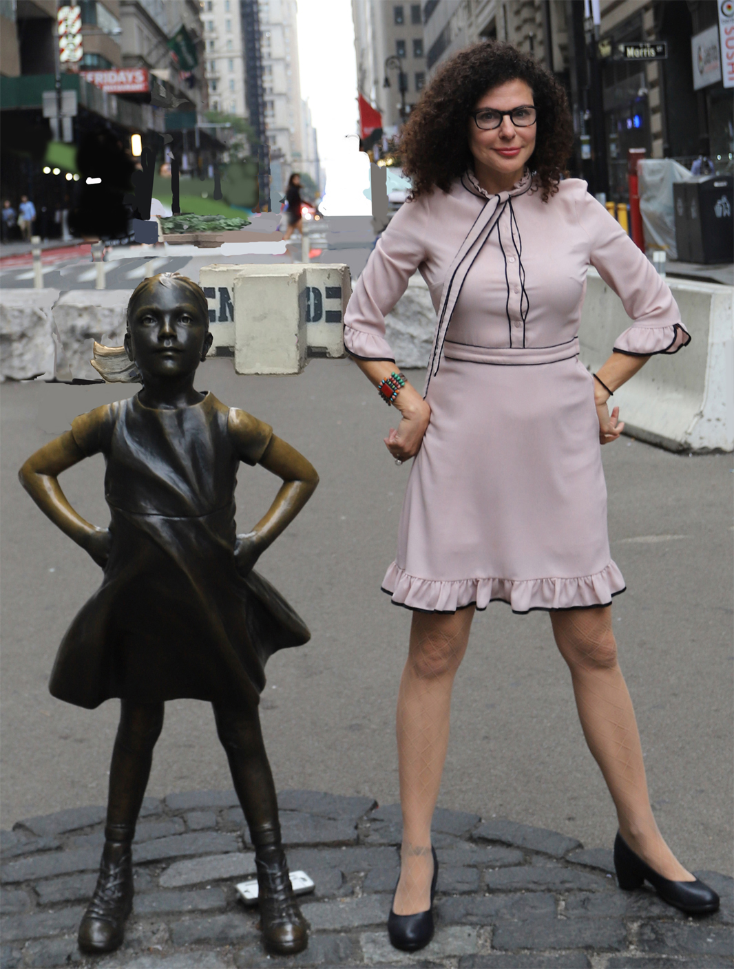 Pamela & Fearless Girl Statue, in New York City. Photo courtesy of Pamela