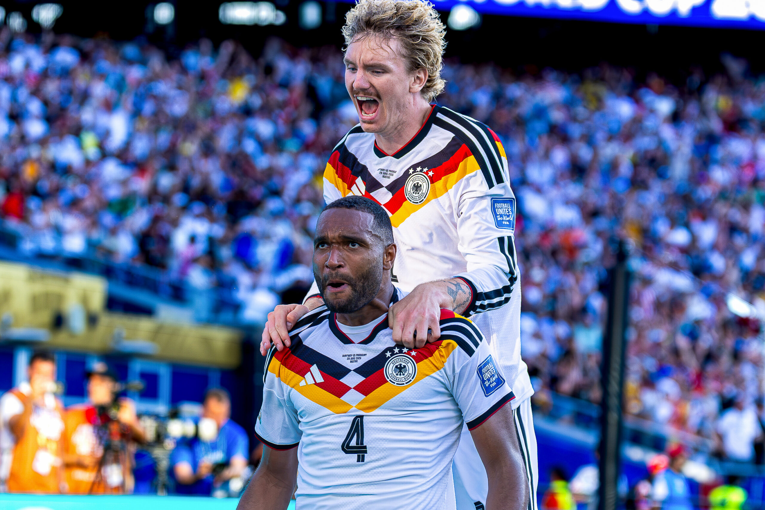 FOXBOROUGH, MA 06/29/2026 FIFA WORLD CUP ROUND OF 32 GERMANY vs PARAGUAY: Jonathan Tah of Germany celebrates his goal with teammate Nick Woltemade at Boston Stadium. - Photo by Irish Maliborski