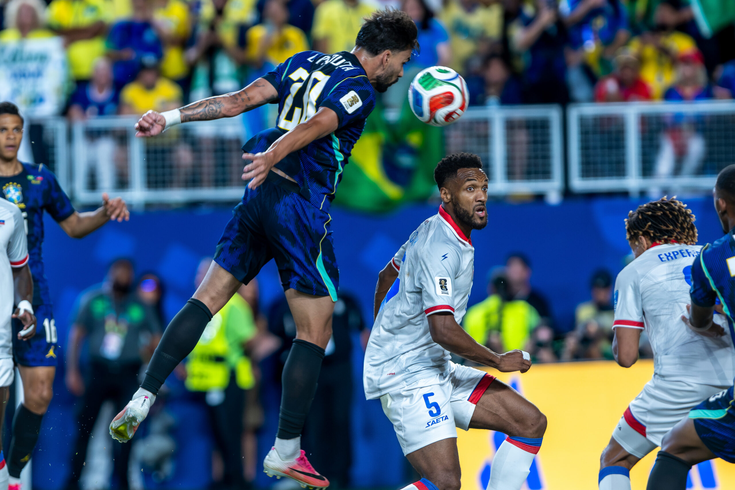 PHILADELPHIA, PA 06/19/2026 2026 FIFA WORLD CUP GROUP C STAGE BRAZIL vs HAITI: Lucas Paquetá of Brazil heads the ball over Haiti defender Hannes Delcroix- Photo by Irish Maliborski