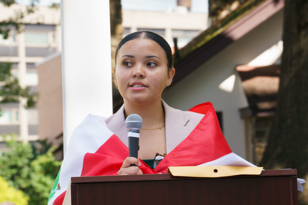 Omega Phi Chi President, Kimberly Escate, addressing students and staff at flag ceremony, Wednesday, Sep. 16, 2026.