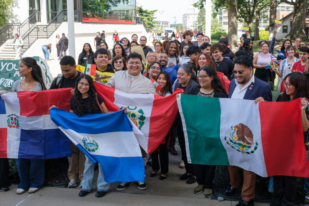 Flag Ceremony attendees posing for a photograph while displaying their flags, Wednesday, Sep. 16, 2026.