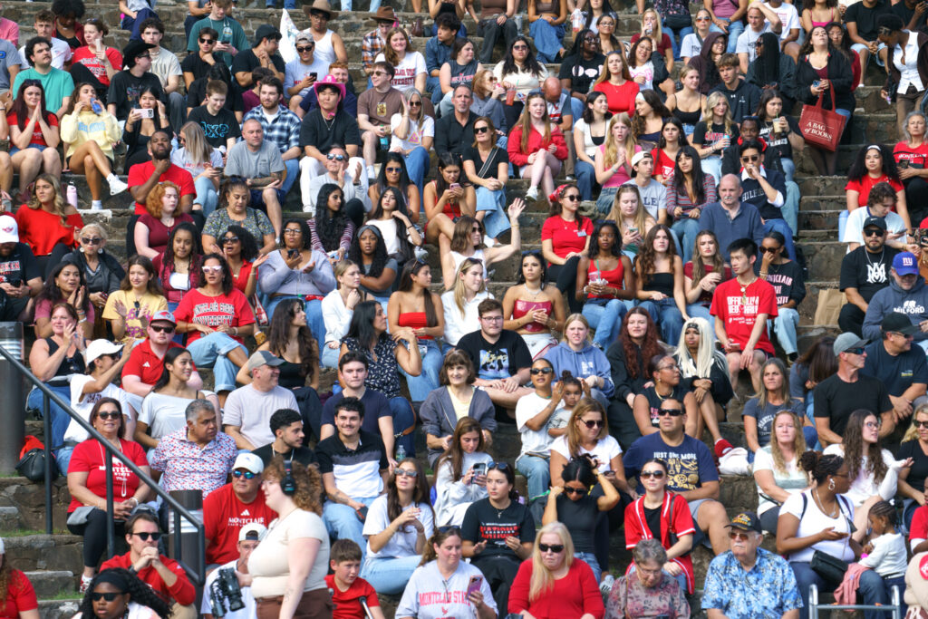 Students, family members, and alumni watching the homecoming showcase at the amphitheater, Saturday, Oct. 3, 2026.