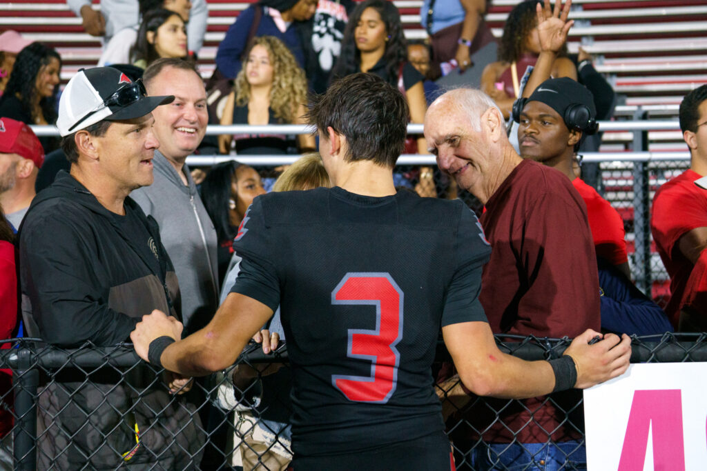 TJ Kachala talking to family and friends after winning the homecoming game, Saturday, Oct. 3, 2026.