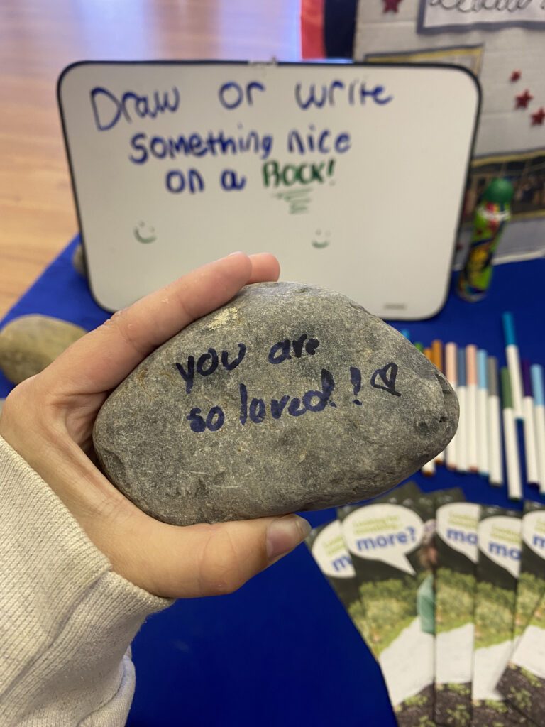One of the rocks found at the Circle K table. The message reads "you are so loved!" with a heart next to it.