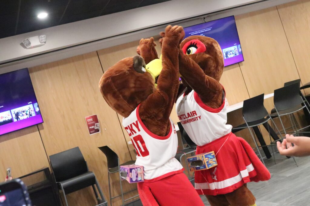Rocky and Roxy Red Hawk high five at Red Hawk Night.
Kaitlin Swift | The Montclarion
