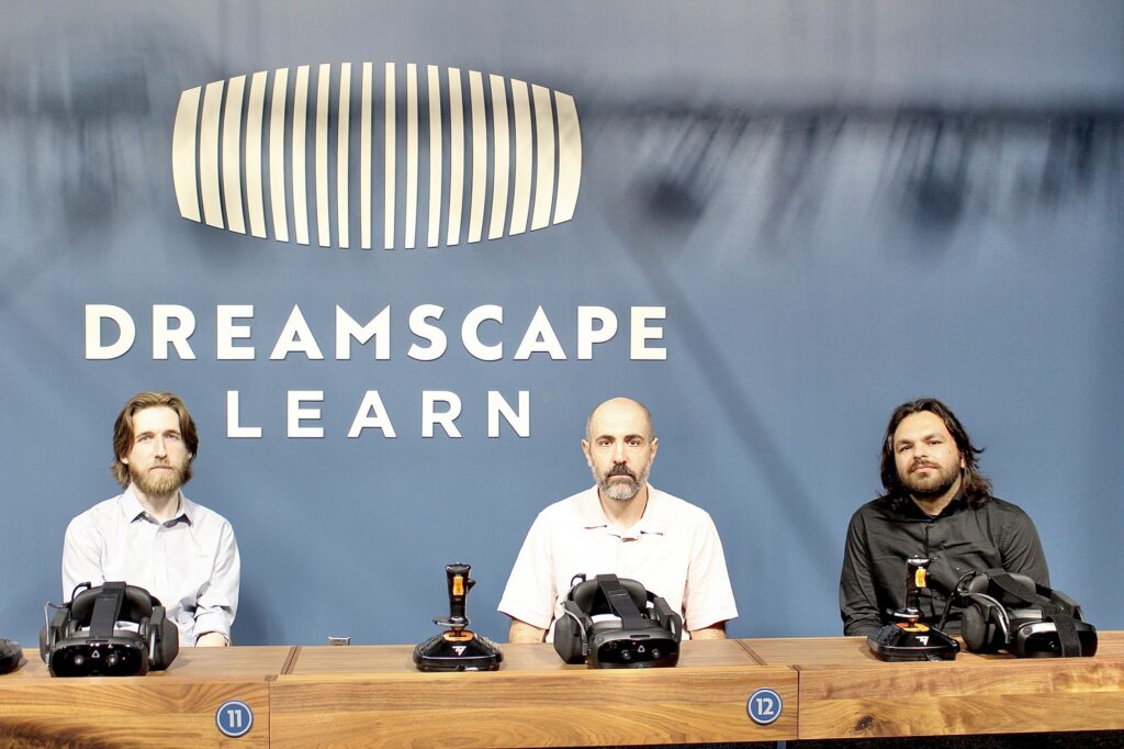 LITTLE FALLS, NJ. 09-24-26, DREAMSCAPES LEARN: Nick Clinkscales, Ben Schwartz, and David Schnepf pose in front of the Dreamscapes Learn logo. Photo by Kaitlin Swift