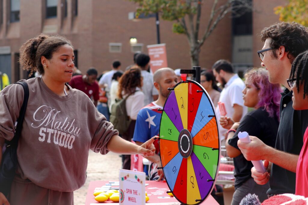 MONTCLAIR, NJ. 10-14-2026. HISPANIC HERITAGE MONTH BLOCK PARTY - ACTIVITIES: On October 14th 2026, the Hispanic Heritage Month Block Party had different clubs and organizations show up with different activites to do to get involved. Some gave out stickers with country flags and others did 'spin the wheel' to win a prize or answer trivia questions. Photograph taken by Estefano Quispe.
