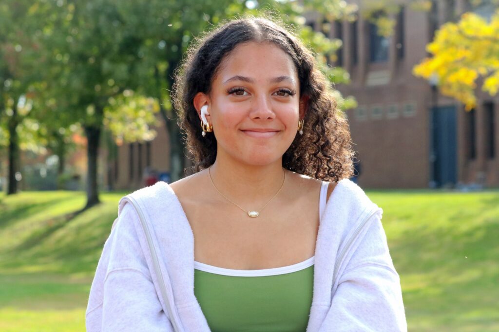 MONTCLAIR, NJ. 10-14-2026. HISPANIC HERITAGE MONTH BLOCK PARTY - CALLEIGH JACKSON: On October 14th 2026, Calleigh Jackson a Puerto Rican student majoring in Business Administration participated in the Hispanic Heritage Month Block Party in Montclair State University. She is seen here posing for a photo with the trees and field behind her. Photograph taken by Estefano Quispe.