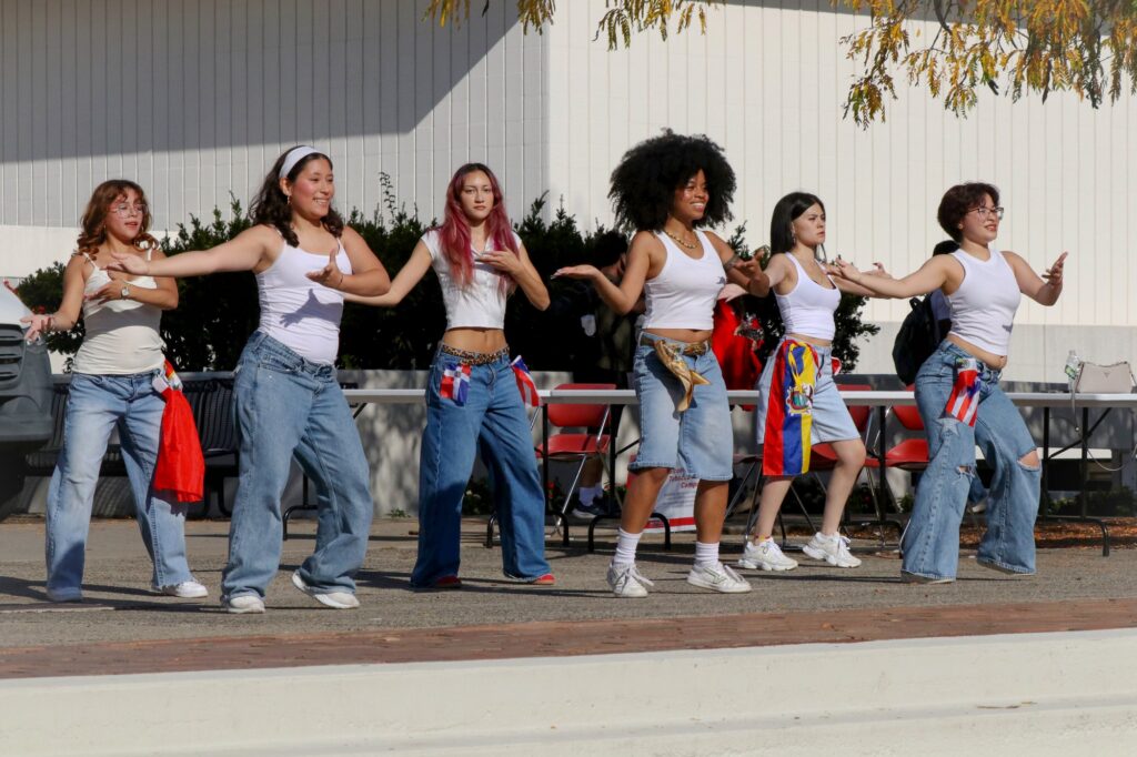 MONTCLAIR, NJ. 10-14-2026. HISPANIC HERITAGE MONTH BLOCK PARTY - LATINISMO DANCERS: On October 14th 2026, the MSU Dance Troup girls performed various dances ontop of the stairs of the quad in Montclair State University. An audience formed to watch the dancers dance with each other as music played in the background. Photograph taken by Estefano Quispe.